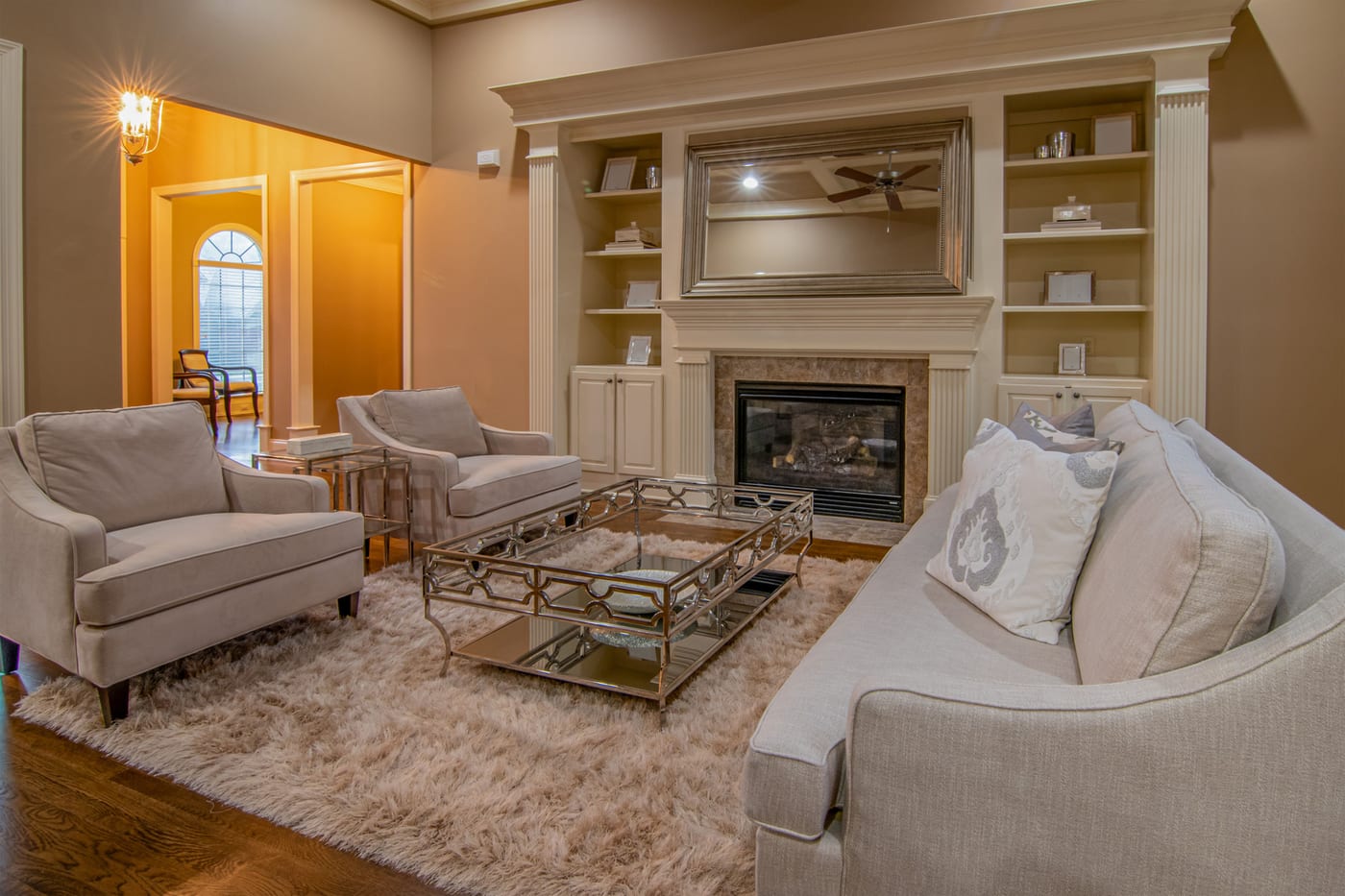 Soft cream shag area rug in a cozy living room, well suited to steam cleaning