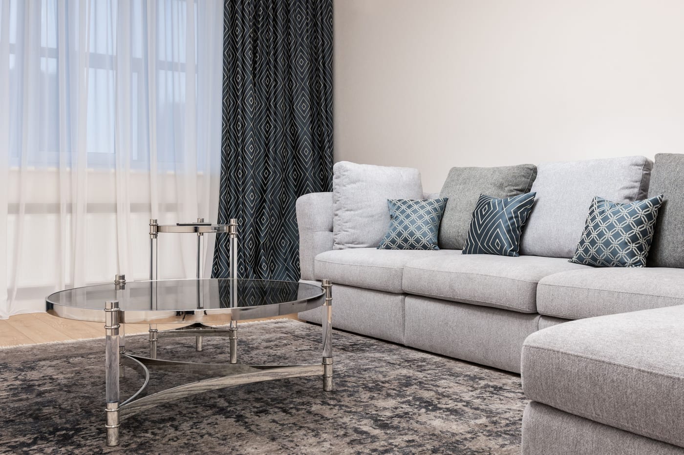 Area rug in a modern living room, exposed to daily foot traffic near the coffee table